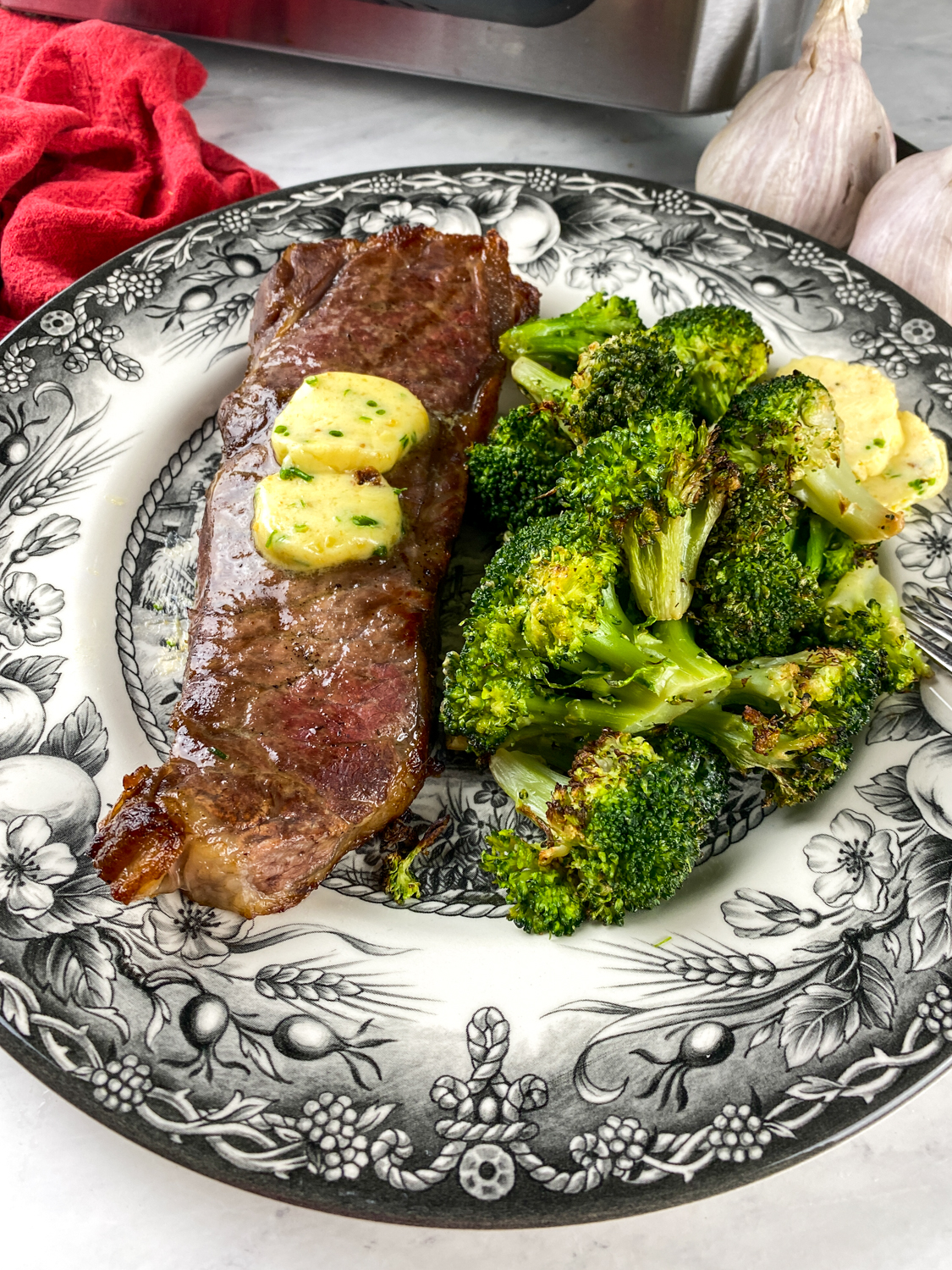Air Fryer Strip Steak with Roasted Garlic Butter